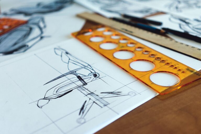 Architectural drawings and drafting tools on a desk