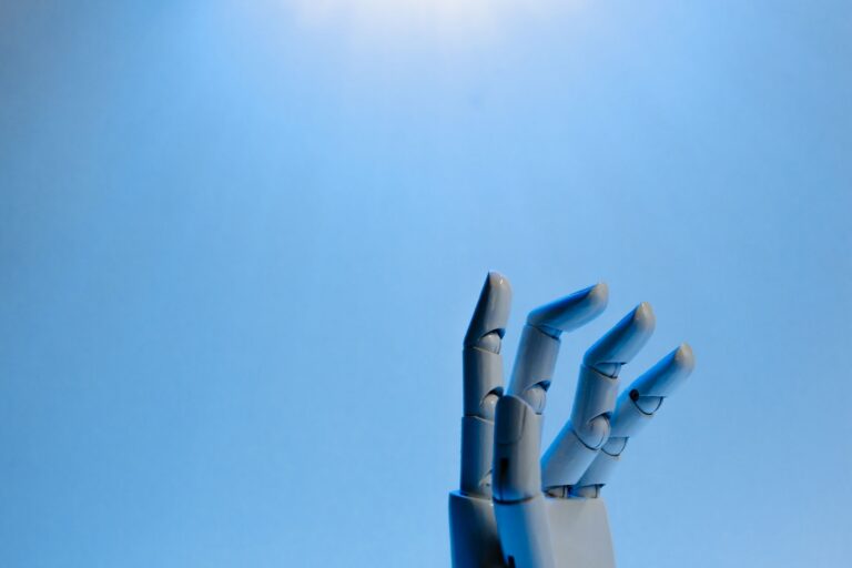 A robotic hand reaching upward